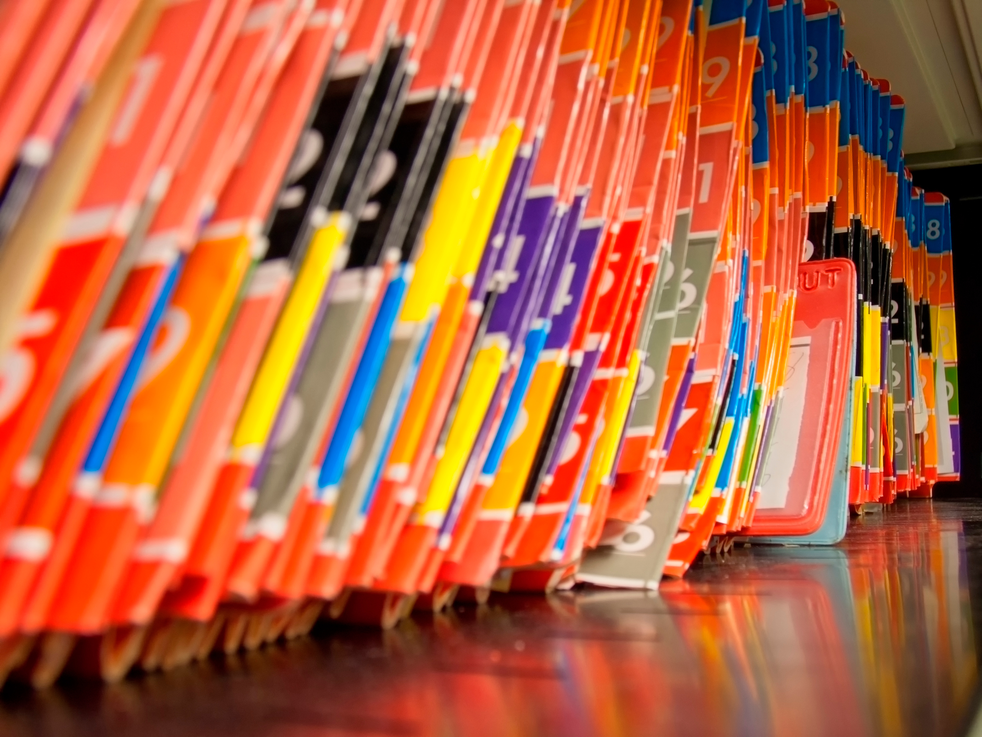 Rows of brightly colored numbered file folders.